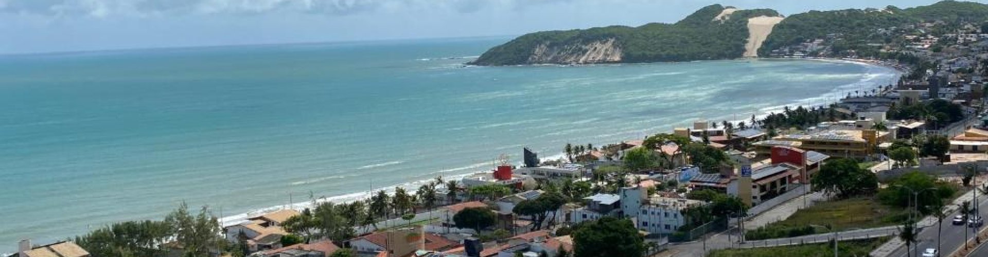 Panoramic view of Ponta Negra coastline at sunset