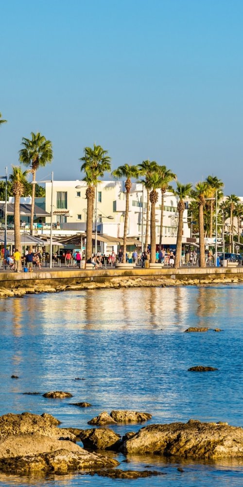 Cyclist and local harbourside path in Paphos